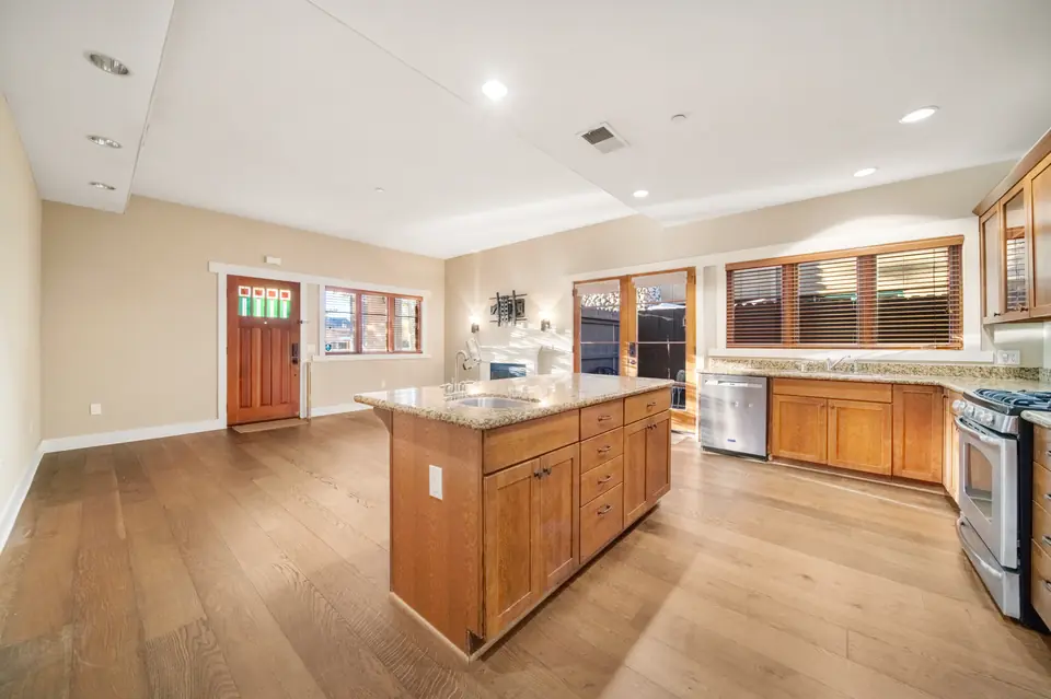Kitchen island with the front door and living area beyond