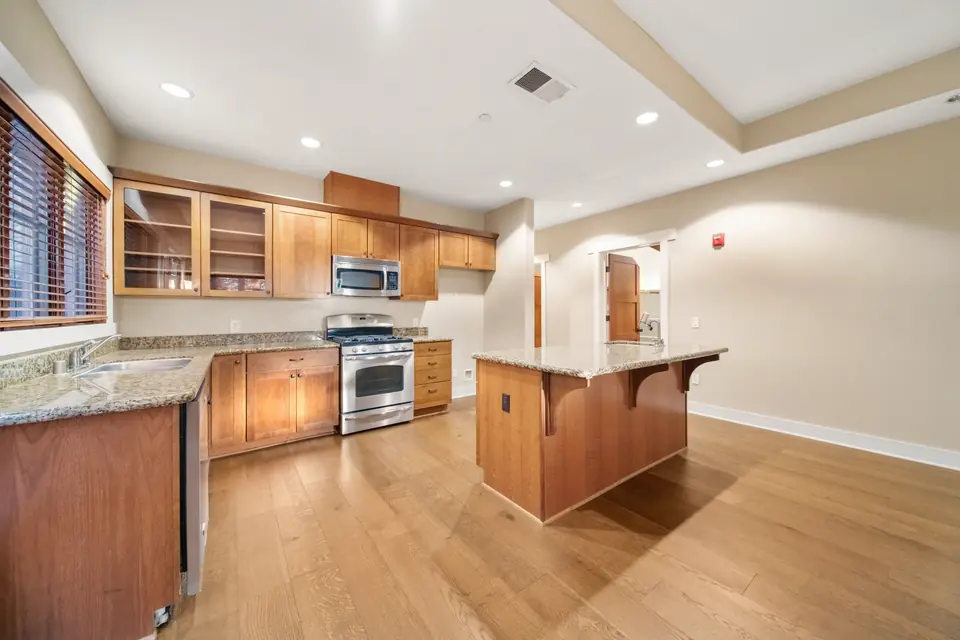 Kitchen and island seen from the dining side