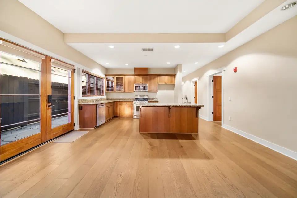 Open living and kitchen area with French doors to the patio