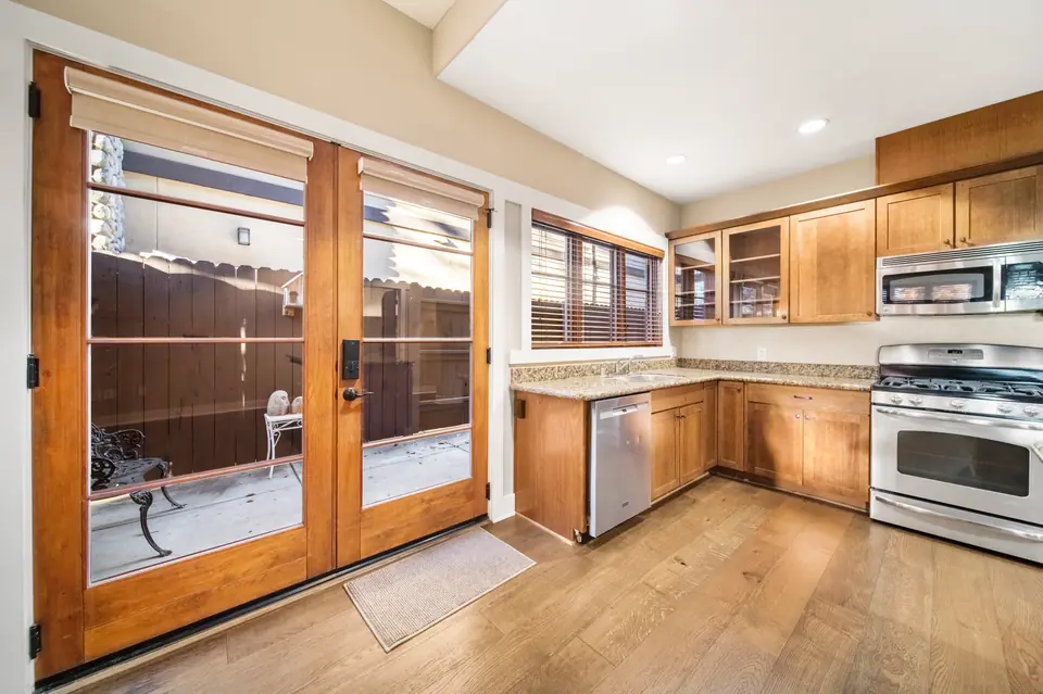 French doors opening to the patio beside the kitchen