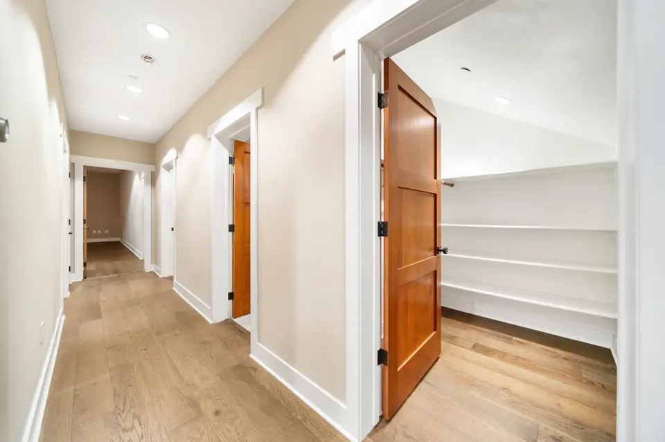 Hallway with a walk-in closet