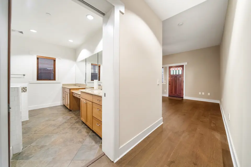 Primary bathroom entry with a tile floor
