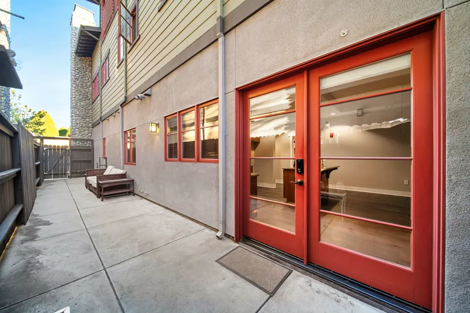 Rear patio with red French doors