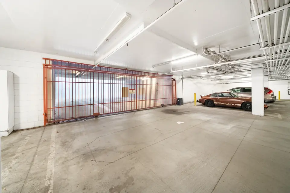 Parking space with gated storage in the garage