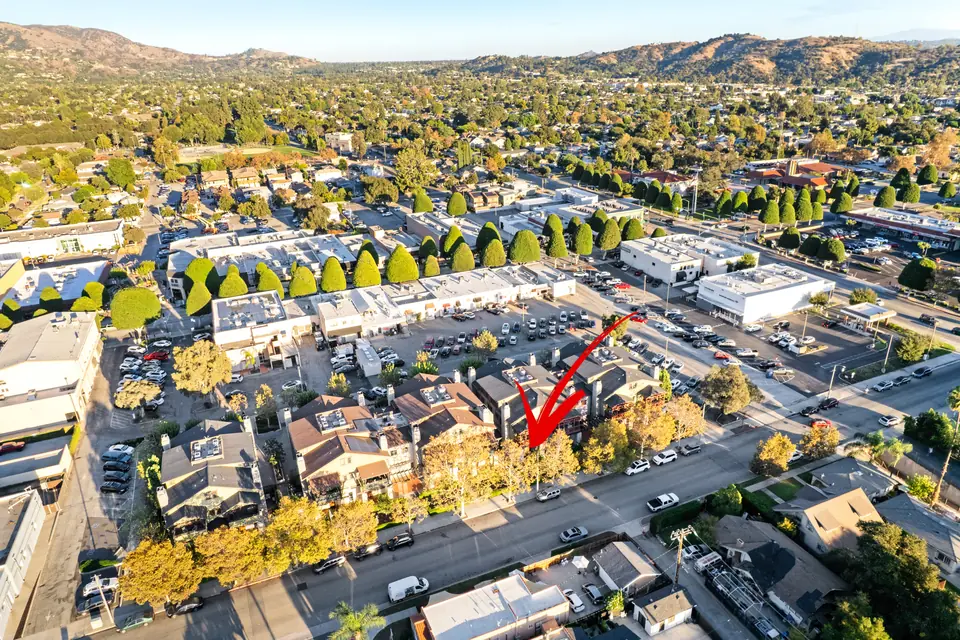 Aerial view of the complex with an arrow marking the home